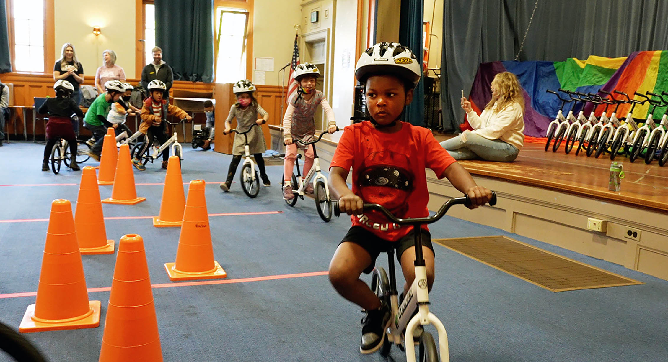 Kids learning how to ride a bike through All Kids Bike