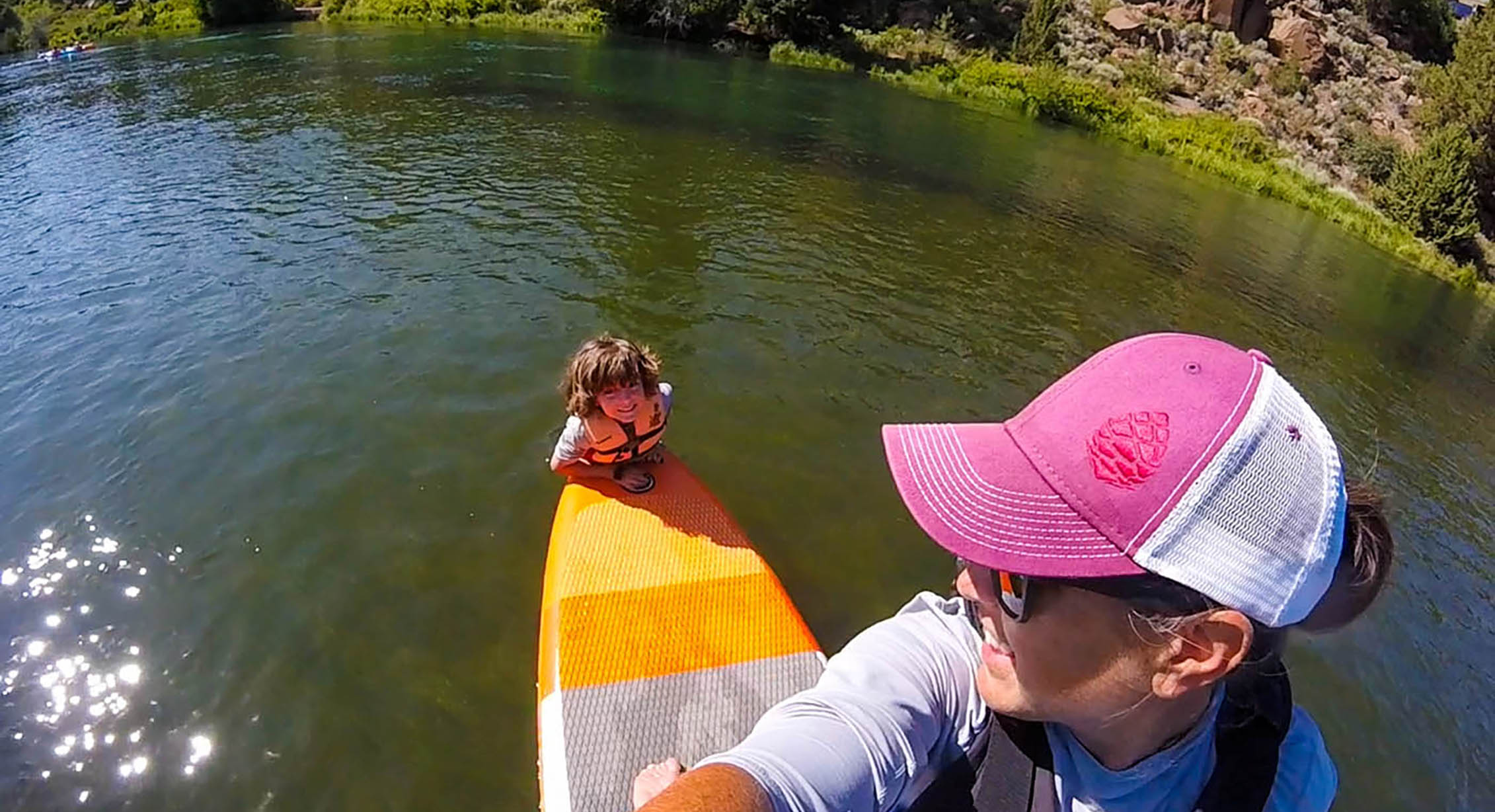 A family SUPing on the Deschutes River
