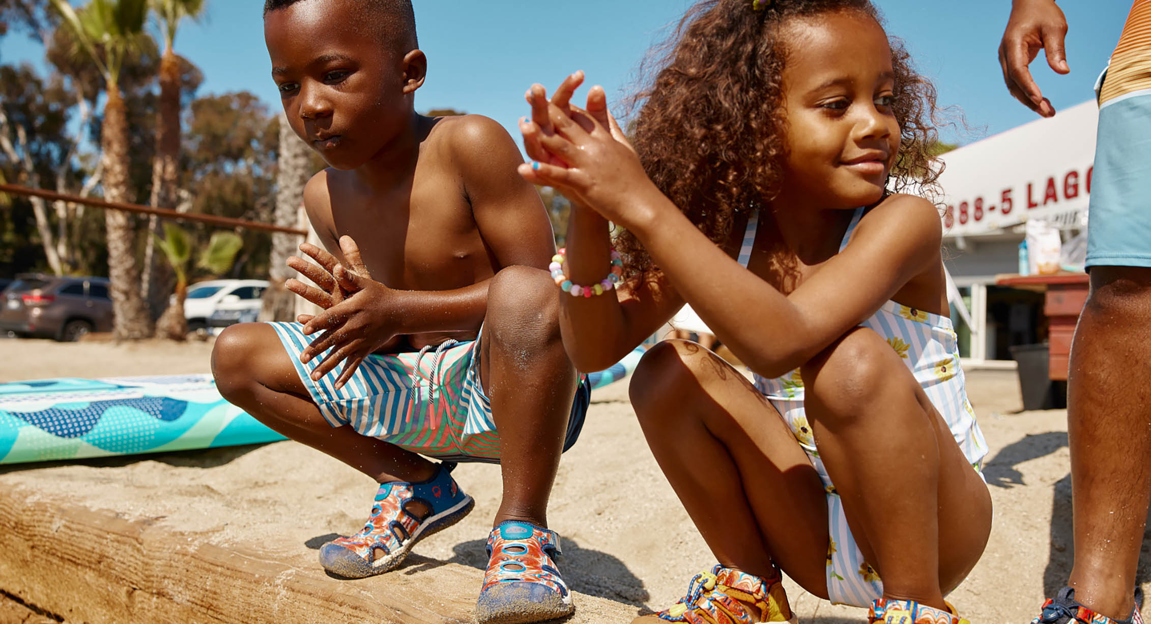 Kids in KEEN x Outdoor Afro sandals getting ready to swim