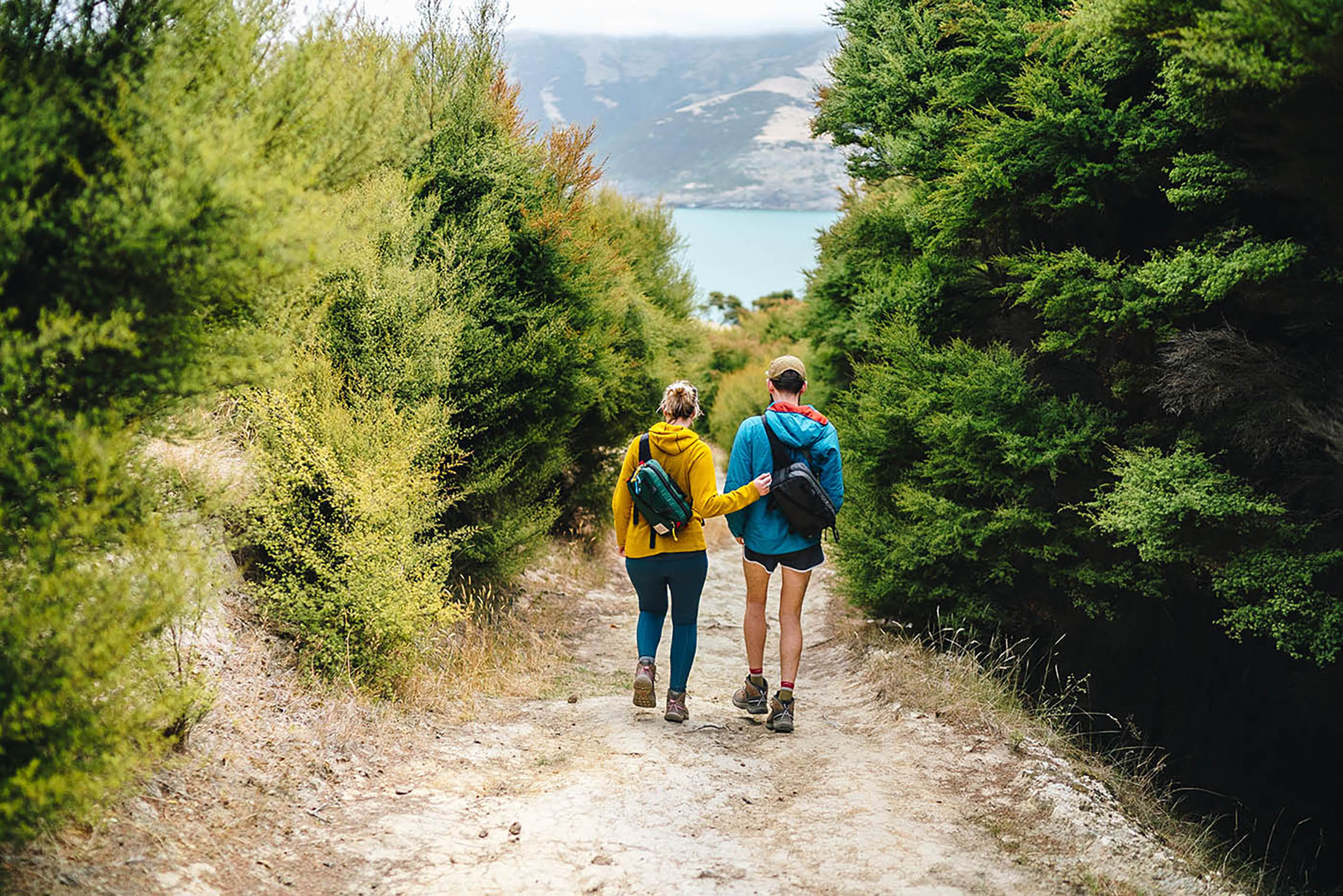 Walking down a trail in KEEN PFC-free hikers