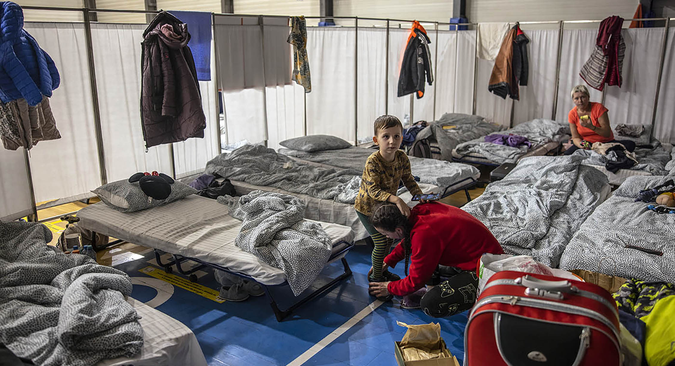 A Ukrainian child in a temporary shelter in Romania